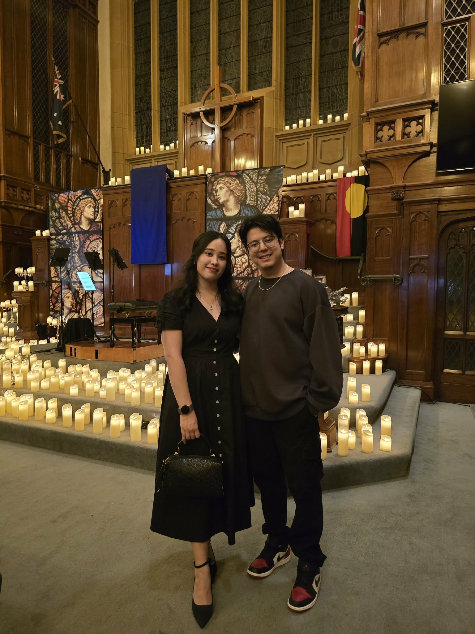 Abhishek and Alyssa surrounded by candlelight