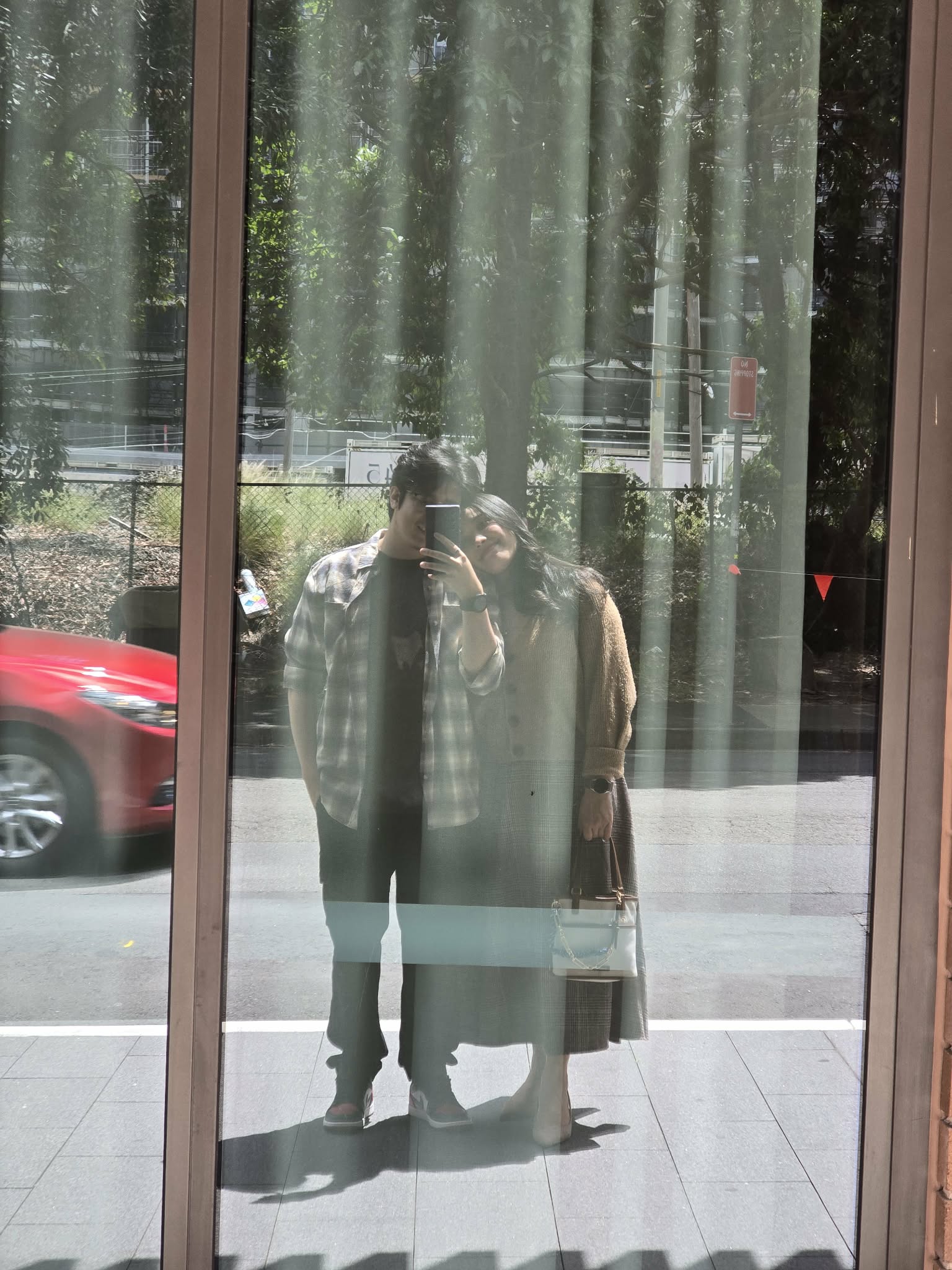 Abhishek and Alyssa taking a reflection photo together
